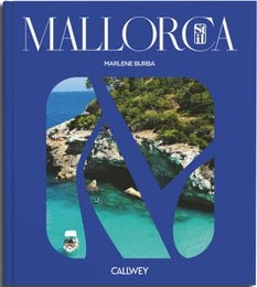 "A hardcover book titled 'Mallorca' featuring a scenic coastal landscape with turquoise waters and lush greenery."