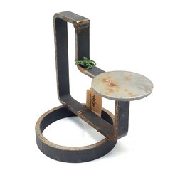 Industrial candlestick with a rustic, vintage-inspired design featuring a metal frame and a round wooden platform.