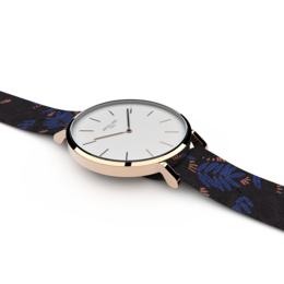 Rose gold and silver-toned watch with a patterned fabric strap.