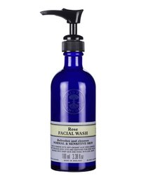 A gentle, rose-scented facial wash in a blue glass bottle with a black pump dispenser. Suitable for all skin types.