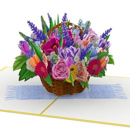 Vibrant floral bouquet in a woven basket, featuring a variety of colorful flowers including roses, lavender, and other blooms. The bouquet is presented in a pop-up card format, making it a unique and eye-catching birthday gift.