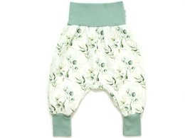 Baby bloomers in a mint green color with a repeating eucalyptus leaf print pattern. Soft, comfortable, and stylish baby pants.