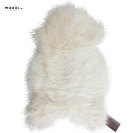 A large, fluffy, white sheepskin throw with a soft, plush texture. The throw appears to be made of high-quality Icelandic wool, providing a cozy and luxurious addition to any living space.