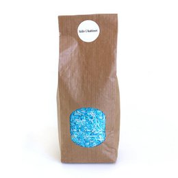 "Playing rice ocean mix (500 grams) - Sensory Toy"
The product appears to be a sensory toy consisting of a mix of blue and white rice grains. The rice grains have a vibrant blue color, creating a visually appealing and textured mix that could be used for sensory play or as a decorative element. The product is packaged in a brown paper bag, which adds to the natural and organic feel of the item.