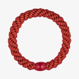  Rust-colored elastic hair tie with a braided texture and a red bead accent.