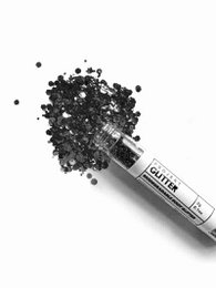Black bio glitter makeup product. Shimmering black glitter particles in a tube.