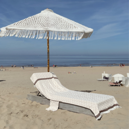 Soft, absorbent beach towel in a variety of vibrant colors including yellow, navy, taupe, black, green, blue, and turquoise. Ideal for lounging on the sand or by the pool.