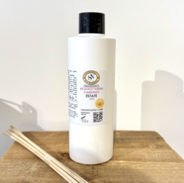  A 225 ml refill bottle for a summer fragrance diffuser. The bottle has a white body and a black cap.