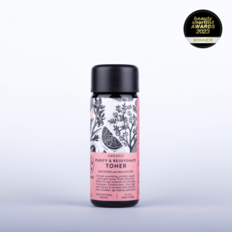 Organic purify and rejuvenate toner in a glass bottle with floral design. Suitable for all skin types, this toner helps cleanse and balance the skin.