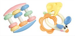 Colorful baby rattles in various shapes and textures, including a round rattle with pastel colors and a teething rattle with an orange ring and blue accents.