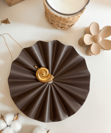  White ceramic leaf-shaped decorative bowl with a textured surface.