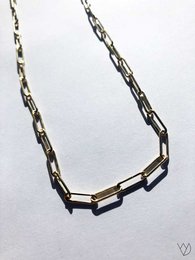  Elegant silver-toned necklace with anchor-shaped metal accents, suitable for casual or formal wear.