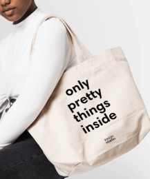 Large beige tote bag with black text "only pretty things inside"