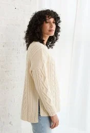 Cream-colored supersoft merino aran sweater with a relaxed, oversized fit. Made from high-quality merino wool for warmth and comfort.