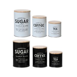  A set of 3 storage jars in varying sizes, labeled "Sugar", "Coffee", and "Tea". The jars have a simple, minimalist design with white and black color schemes.