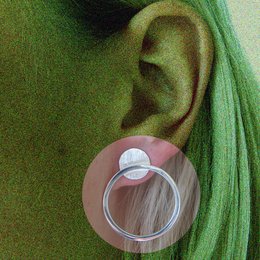 Statement earrings with a clear, circular design.