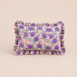  Rectangular cushion with a violet garden floral pattern and ruffled edges.