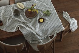 Ice grey linen tablecloth, 250x145 cm, minimalist table setting with ceramic vase and dishes.