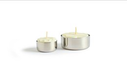Stainless steel tealight holders in standard and large sizes, suitable for use with tealight candles.
