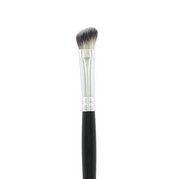 Angled eyeshadow brush with black handle and white bristles, suitable for applying and blending eyeshadow.