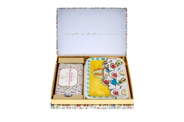  Colorful gift box containing assorted soap bars with decorative patterns and shapes.