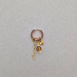 Brown drop earring with gold chain and hanging charms, delicate single piece jewelry