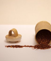  Wooden storage jar with lid, used to store herbs or spices. Cylindrical shape with a natural wood finish.