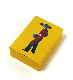 Rectangular yellow storage box with a graphic design of a person on the lid.