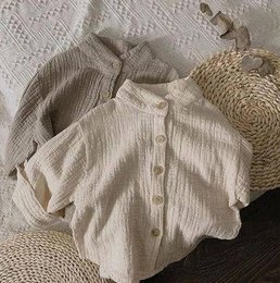 Cream-colored muslin shirt for kids, available in sizes 12-18M to 7-8Y. Features a button-up design and a relaxed, comfortable fit.
