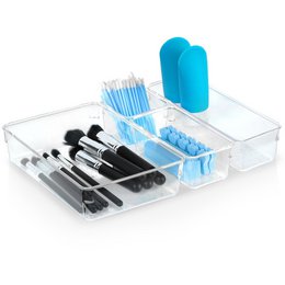  Acrylic makeup organizer with 4 compartments for storing various makeup tools and accessories. Transparent design allows easy visibility and organization of items.