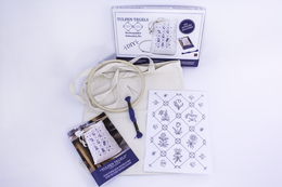 "DIY embroidery kit with tulip tile pattern, cream tote bag, includes needle and thread for crafting"