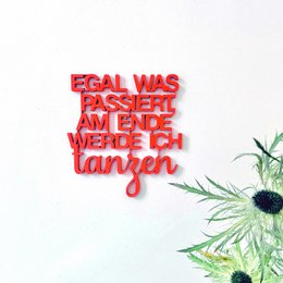 A red embroidered patch with the text "EGAL WAS PASSIERT, AM ENDE WERDE ICH TANZEN" (German for "No matter what happens, I'll end up dancing").