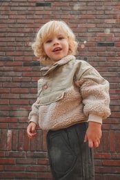  Cozy fleece pullover for kids, available in sizes 18M to 6Y. Features a soft, fuzzy texture and neutral beige color.