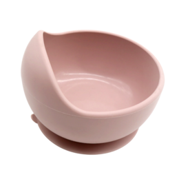  A round, powder pink bowl made of ceramic material, suitable for use by children.