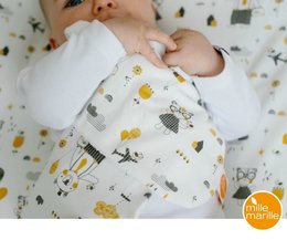 Soft, absorbent burp cloth featuring a whimsical print with owls, stars, and other playful designs. Perfect for catching spit-up and keeping baby comfortable.