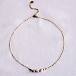 Delicate chain with small pearls and gold-tone details