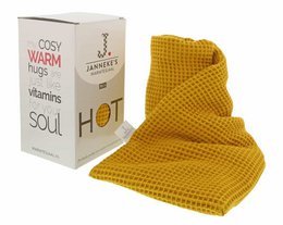 Cozy warm knit blanket in ocher yellow color made from organic linseed fabric.