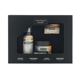 This Treatments® - GSSS - Giftbox Shower & Scrub - Shinshiro set includes a shower gel, body scrub, and body cream. The products feature a natural, earthy scent and are packaged in a gift box.