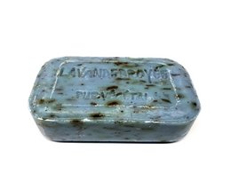 Rectangular olive oil soap bar with lavender scent, made in France, featuring a textured surface with a natural, earthy appearance.