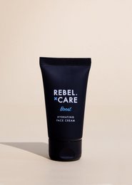 Face cream in a dark blue tube labeled "Rebel Care". The cream is designed to boost and nourish the skin.