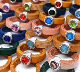  Colorful assortment of kids' glass crystal rings in various metallic finishes including antique silver and 24K gold. The rings feature a variety of gemstone shapes and colors including round, heart, and animal shapes.
