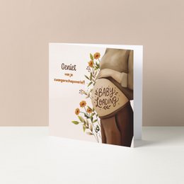  Colorful baby card with whimsical illustrations of baby toys and accessories, including a rattle, pacifier, and wooden blocks.