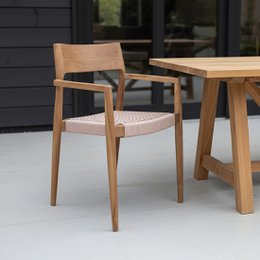  Wooden garden chair with natural armrest and dark teakwood finish. Sturdy and stylish design suitable for outdoor use.