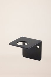  Black metal bottle holder with simple, minimalist design.