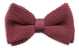 A mauve-colored knitted bow tie for kids, featuring a textured pattern and a solid color design.