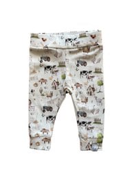 Newborn baby pants in a countryside print featuring various farm animals like cows, sheep, and horses. The pants come in sizes 44, 50, 56, 62, and 68.