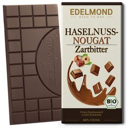 Dark chocolate bar with organic hazelnut nougat pieces.