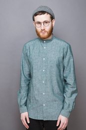 Green button-down shirt with band collar, suitable for casual wear.