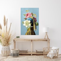 A large floral arrangement featuring pink roses, white flowers, and greenery against a blue background.