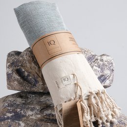 Large, soft, blue and white hammam towel made of 100% cotton, perfect for use in the sauna, at the beach, or as a decorative accent.